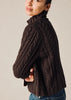 100% cashmere turtleneck in a chunky hand knit cable in chocolate marle brown